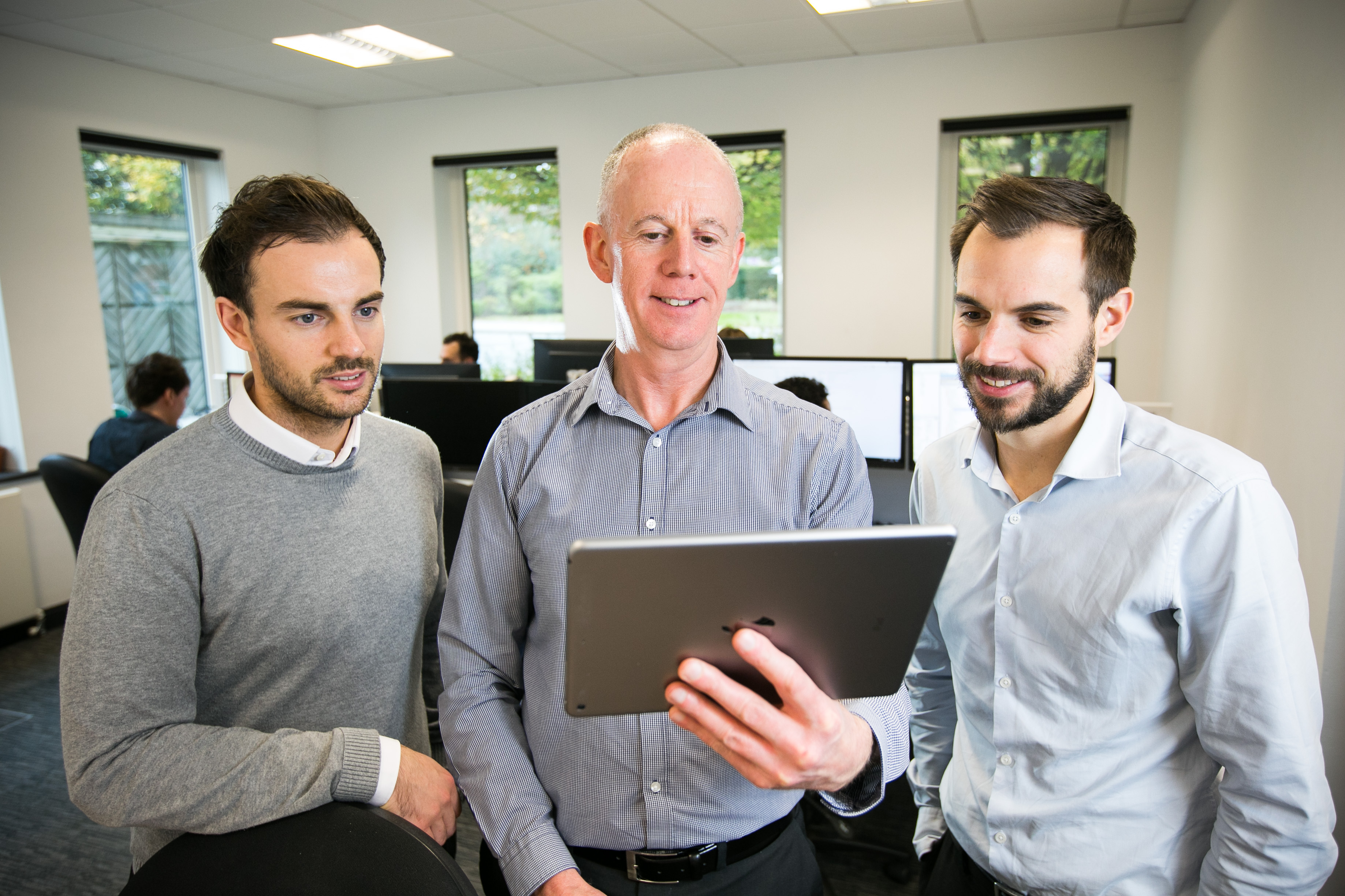 OWA team reviewing a successful website development and delivery