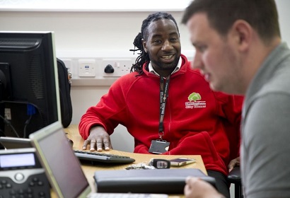 Trades Union Congress – image of two people talking to each other at work